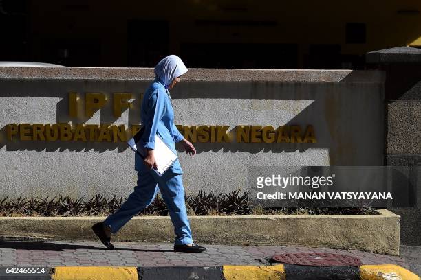Malaysian medical nurse walks past the forensic wing at the Hospital Kuala Lumpur on February 18, 2017 where the body of North Korean man suspected...