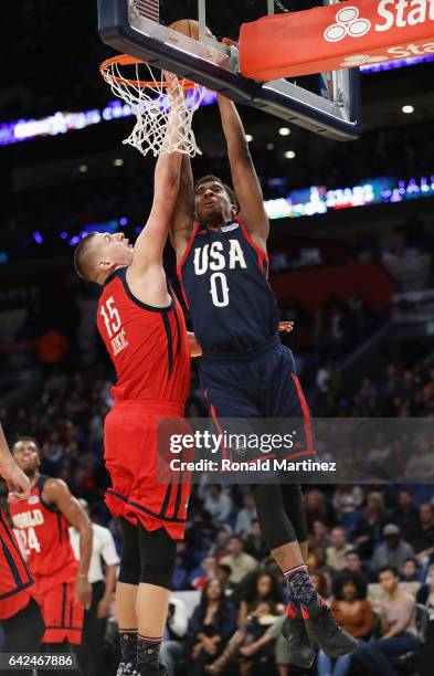 Marquese Chriss of the Phoenix Suns attempts to dunk the ball against Nikola Jokic of the Denver Nuggets in the second half of the 2017 BBVA Compass...