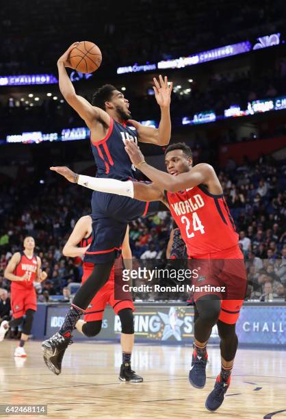 Karl-Anthony Towns of the Minnesota Timberwolves drives to the basket against Buddy Hield of the New Orleans Pelicans in the second half of the 2017...