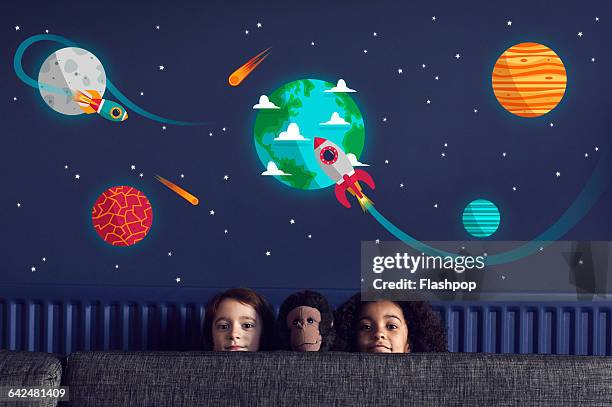 girls with toy sitting under stars and planets - navy blues v pies legends stock pictures, royalty-free photos & images