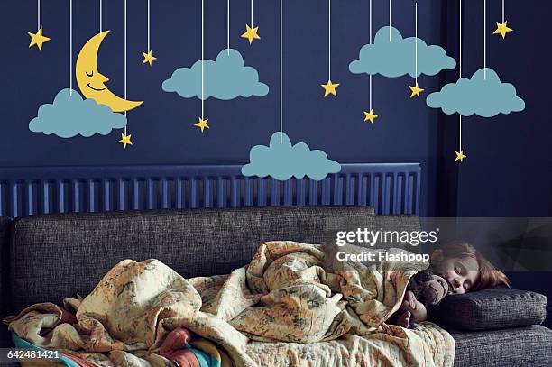 girl sleeping under the stars and moon - childhood dream stock pictures, royalty-free photos & images