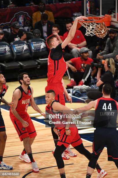 Kristaps Porzingis of the World Team dunks the ball during the BBVA Compass Rising Stars Challenge as part of 2017 All-Star Weekend at the Smoothie...
