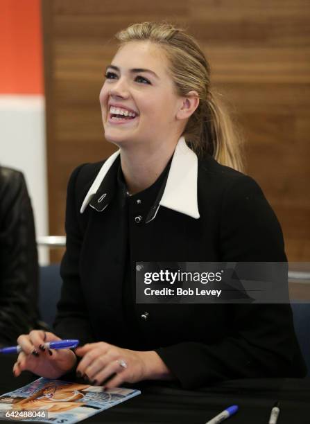 Swimsuit Cover model Kate Upton signs copies of the 2017 SI Swimsuit at the VIBES by Sports Illustrated Swimsuit 2017 launch festival on February 17,...