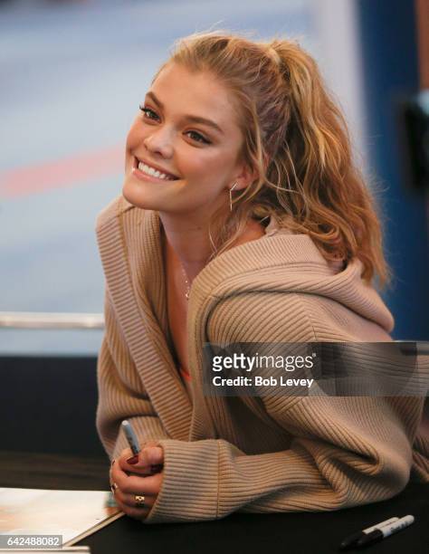 Swimsuit model Nina Agdal signs copies of the 2017 SI Swimsuit at the VIBES by Sports Illustrated Swimsuit 2017 launch festival on February 17, 2017...