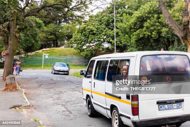 school child travelling with head out the taxi window - taxi boys stock pictures, royalty-free photos & images