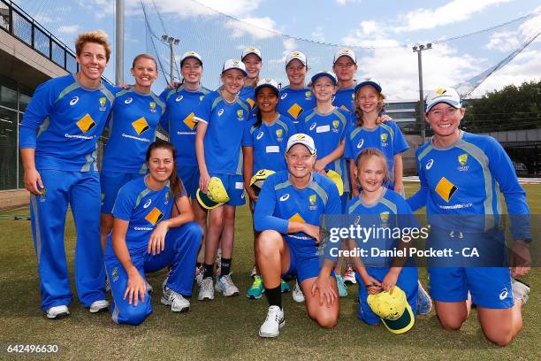 The Southern Stars pose for a photo with five young fans during a Southern Stars training session at Melbourne Cricket Ground on February 18, 2017 in...
