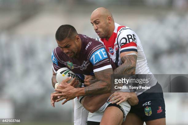 Frank Winterstein of the Sea Eagles is tackled by Blake Ferguson of the Roosters during the NRL Trial match between the Manly Warringah Sea Eagles...