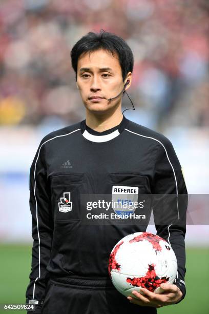 Referee Hiroyuki Kimura holds the ball prior to the Xerox Super Cup match between Kashima Antlers and Urawa Red Diamonds at Nissan Stadium on...