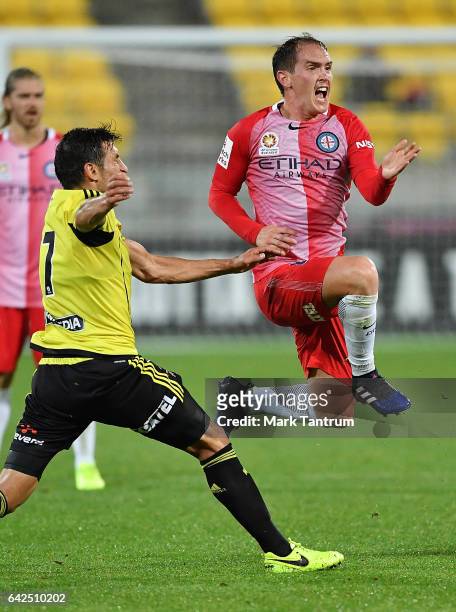 Gui Finkler of the Wellington Phoenix tackles Neil Kilkenny of Melbourne City during the round 20 A-League match between the Wellington and Melbourne...