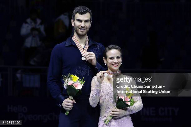Second place winner Meagan Duhamel and Eric Radford of Canada pose on the podium after the medals ceremony of the Pairs during ISU Four Continents...