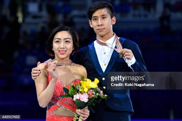 Gold medalists Wenjing Sui and Cong Han of China pose on the podium during the medals ceremony of the Pairs during ISU Four Continents Figure Skating...