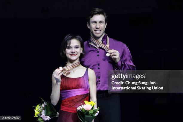 Third place winner Liubov Ilyushechkina and Dylan Moscovitch of Canada pose on the podium after the medals ceremony of the Pairs during ISU Four...