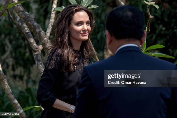 Angelina Jolie arrives at a press conference ahead of the premiere of her new film "First They Killed My Father" set up at the Raffles Grand Hotel...