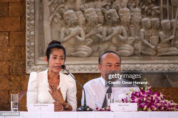 Actress Sveng Socheata speaks emotionally while producer Rithy Panh listens during a press conference ahead of the premiere of their new film "First...