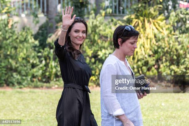 Angelina Jolie greets members of the press while leaving a press conference ahead of the premiere of her new film "First They Killed My Father" set...