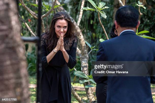 Angelina Jolie leaves a press conference ahead of the premiere of her new film "First They Killed My Father" set up at the Raffles Grand Hotel...