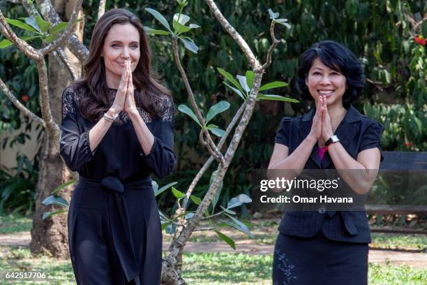 Angelina Jolie and author Loung Ung greet during their arrival at a press conference ahead of the premiere of their new film "First They Killed My...