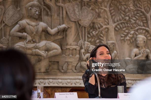 Angelina Jolie talks to press during a press conference ahead of the premiere of her new movie "First They Killed My Father" set up at the Raffles...