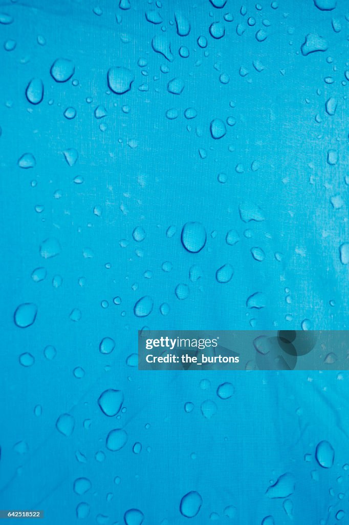 Full frame shot of water drops on blue tent