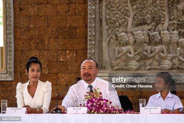 Actress Sveng Socheata and actress Sareum Srey Moch listen to producer Rithy Panh speak during a press conference ahead of the premiere of their new...