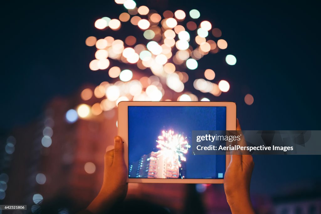 Taking a photo of firework display
