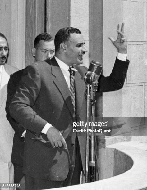 Egyptian President Gamal Abdel Nasser gestures as he speaks from a balcony, Cairo, Egypt, July 31, 1956. His speech followed his return from...