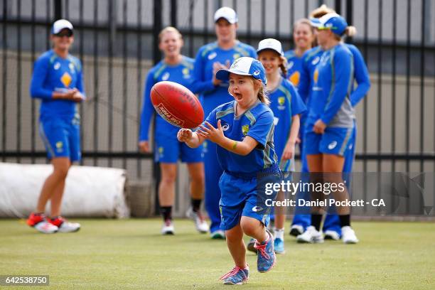 Some young fans participate in some warm-up drills with the players during a Southern Stars training session at Melbourne Cricket Ground on February...