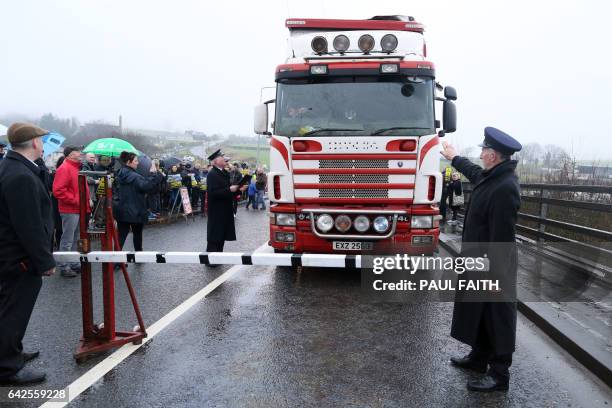 Demonstrators dressed as custom officials set up a mock customs checkpoint at the border crossing in Killeen, near Dundalk to protest against the...