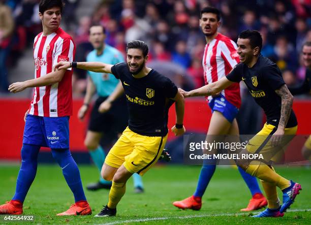 Atletico Madrid's Belgian forward Yannick Ferreira Carrasco celebrates after scoring a goal during the Spanish league football match Real Sporting de...