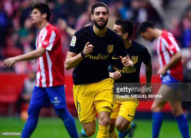Atletico Madrid's Belgian forward Yannick Ferreira Carrasco celebrates after scoring a goal during the Spanish league football match Real Sporting de...