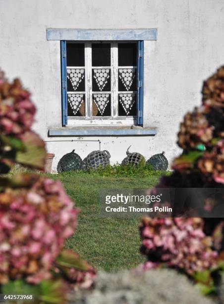 traditional breton lacework at the window - océan atlantique stockfoto's en -beelden