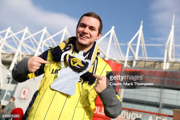 Oxford United fan poses for a photograph with his homemade FA Cup trophy prior to The Emirates FA Cup Fifth Round match between Middlesbrough and...