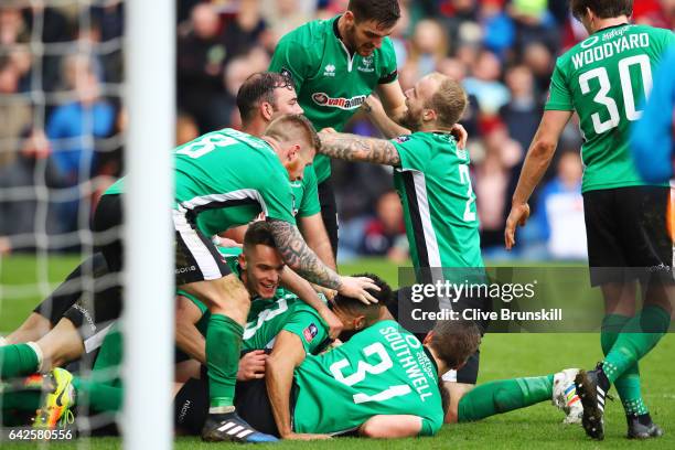 Sean Raggett of Lincoln City celebrates scoring his sides first goal with his Lincoln City team mates during The Emirates FA Cup Fifth Round match...