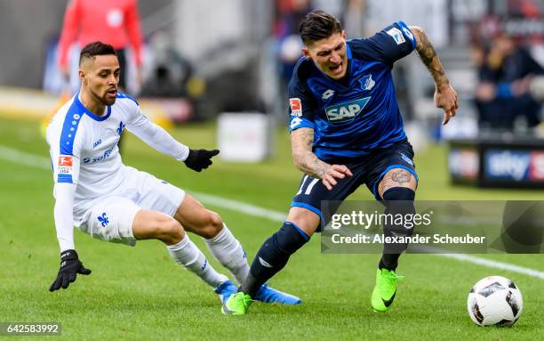 Sidney Sam of Darmstadt challenges Steven Zuber of Hoffenheim during the Bundesliga match between TSG 1899 Hoffenheim and SV Darmstadt 98 at Wirsol...