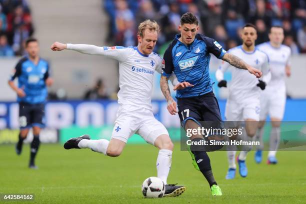 Jan Rosenthal of Darmstadt is challenged by Steven Zuber of Hoffenheim during the Bundesliga match between TSG 1899 Hoffenheim and SV Darmstadt 98 at...