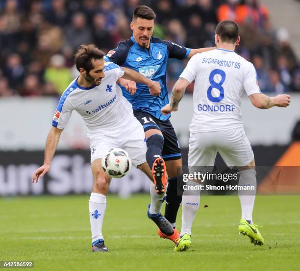 Sandro Wagner of Hoffenheim is challenged by Hamit Altintop and Jerome Gondorf of Darmstadt during the Bundesliga match between TSG 1899 Hoffenheim...