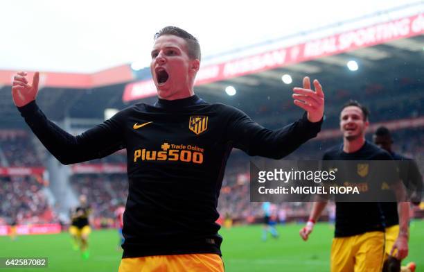 Atletico Madrid's French forward Kevin Gameiro celebrates after scoring a goal during the Spanish league football match Real Sporting de Gijon vs...