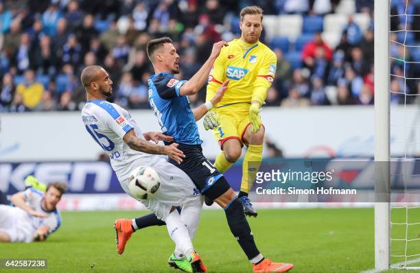 Terrence Boyd of Darmstadt tries to score against Sandro Wagner and goalkeeper Oliver Baumann of Hoffenheim during the Bundesliga match between TSG...