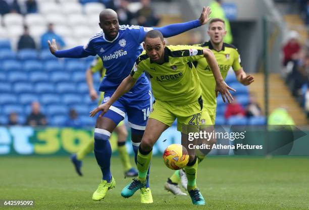Dexter Blackstock of Rotherham United is closely marked by Sol Bamba of Cardiff City during the Sky Bet Championship match between Cardiff City and...