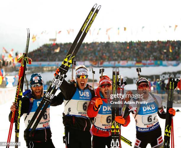 Simon Eder, Daniel Mesotitsch, Julian Eberhard and Dominik Landertinger celebrate winning the Bronze medal after the Men's 4x 7.5km relay competition...