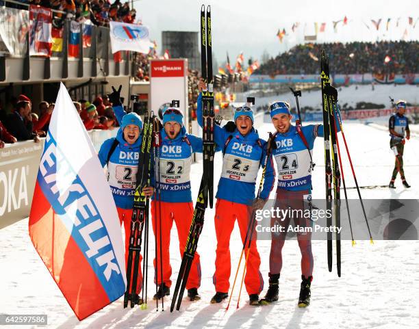 Alexey Volkov, Maxim Tsvetkov, Anton Babikov and Anton Shipulin of Russia celebrate victory in the Men's 4x 7.5km relay competition of the IBU World...