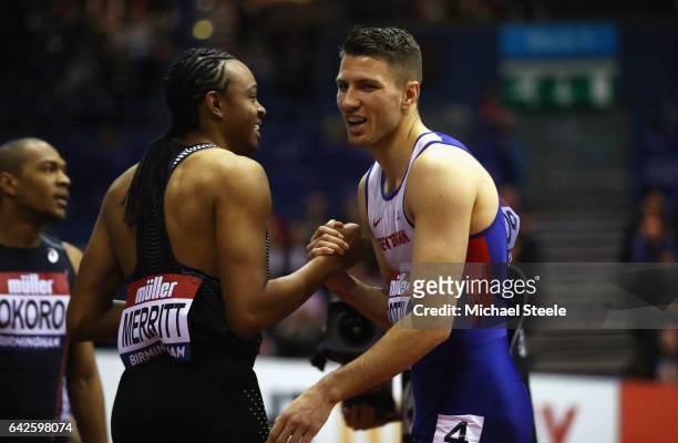 Andrew Pozzi of Great Britain shakes hands with Aries Merritt of the United States as he wins the Mens 60 metres hurdles final during the Muller...
