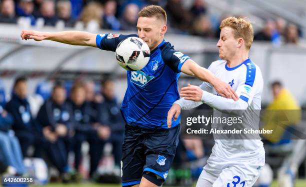 Fabian Holland challenges Pavel Kaderabek of Hoffenheim during the Bundesliga match between TSG 1899 Hoffenheim and SV Darmstadt 98 at Wirsol...