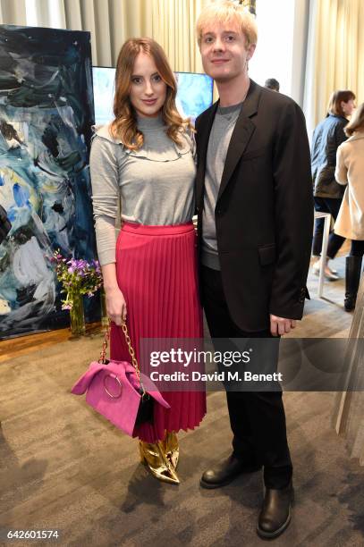 Creative director Dominic Jones poses with Rosie Fortescue during the Astley Clarke AW17 Presentation during London Fashion Week at Savoy Place on...