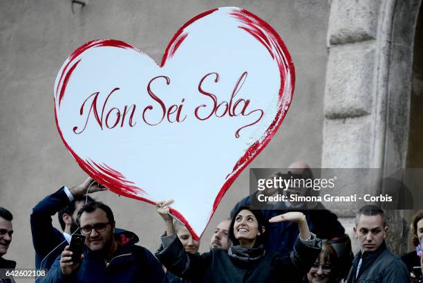 Mayor of Rome Virginia Raggi greets supporters at the Capitol offering her support and holds a big heart in her hand given to her by the protesters...
