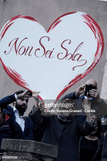 Mayor of Rome Virginia Raggi greets supporters at the Capitol offering her support and holds a big heart in her hand given to her by the protesters...