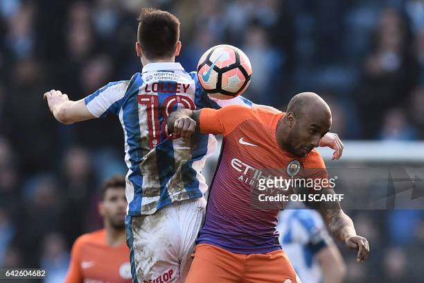 Huddersfield Town's English midfielder Joe Lolley vies with Manchester City's English midfielder Fabian Delph during the English FA Cup fifth round...