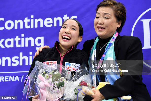 Mai Mihara of Japan celebrates with her coach Sonoko Nakano at the kiss and cry after the Ladies Free Skating during ISU Four Continents Figure...