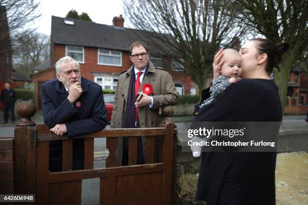 British Labour party leader Jeremy Corbyn meets Margot Dallimie, aged 11 months and her mother Libby Wilkinson, as he campaigns on the streets of...