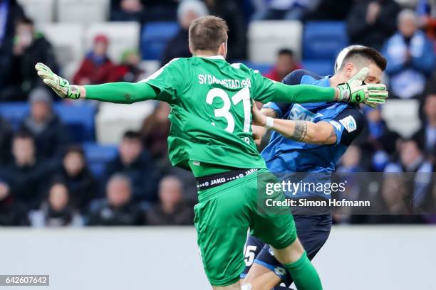 Niklas Suele of Hoffenheim tries to score against Michael Esser of Darmstadt during the Bundesliga match between TSG 1899 Hoffenheim and SV Darmstadt...